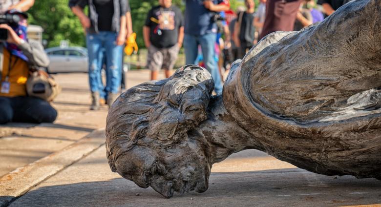 The fallen Christopher Columbus statue outside the Minnesota State Capitol after a group led by American Indian Movement members tore it down in St. Paul, Minnesota, on June 10, 2020.