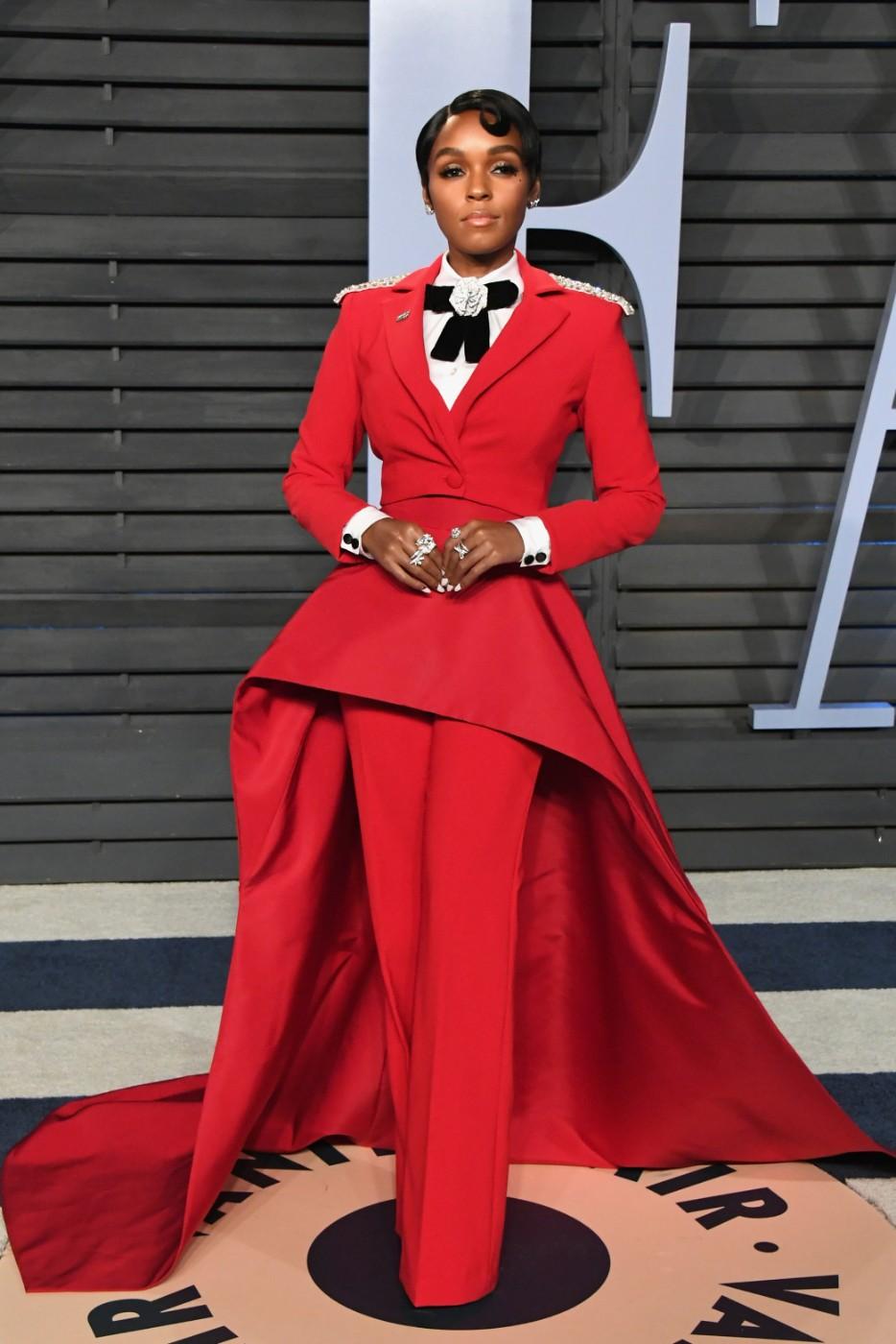 Janelle Monáe in a Christian Siriano red evening suit, shirt and accessories at the 2018 Vanity Fair Oscar Party
