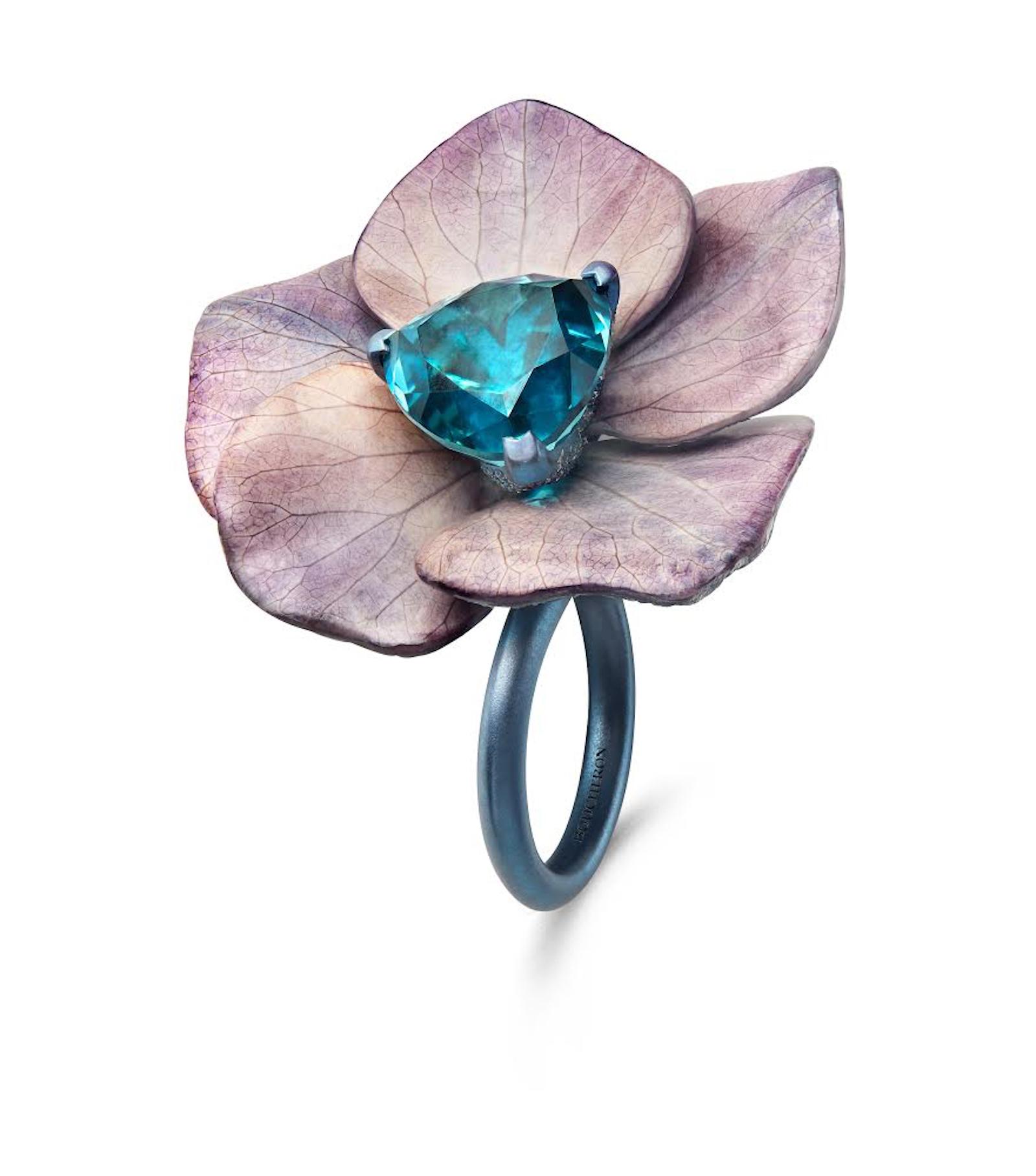 Purple petals with a large, central gem