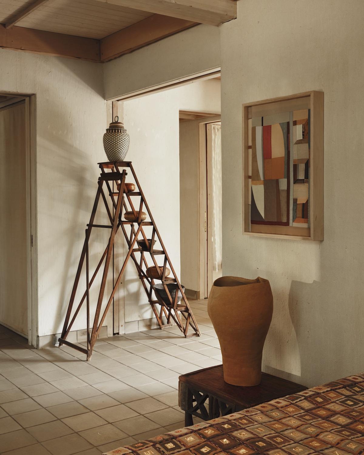 A Summer Arrangement: Object &amp; Thing at LongHouse. LongHouse, East Hampton, New York. Photo by Adrian Gaut. Works pictured: [back wall]: ladder and baskets from the collection of LongHouse with a work by Jeremy Frey on the top rung; [wall] Kiva Motnyk, Light Reflections (2023); [side table] Ludmilla Balkis, Monochrome No. 04, (2021); [bed] Jack Lenor Larsen, Magnum (1970).