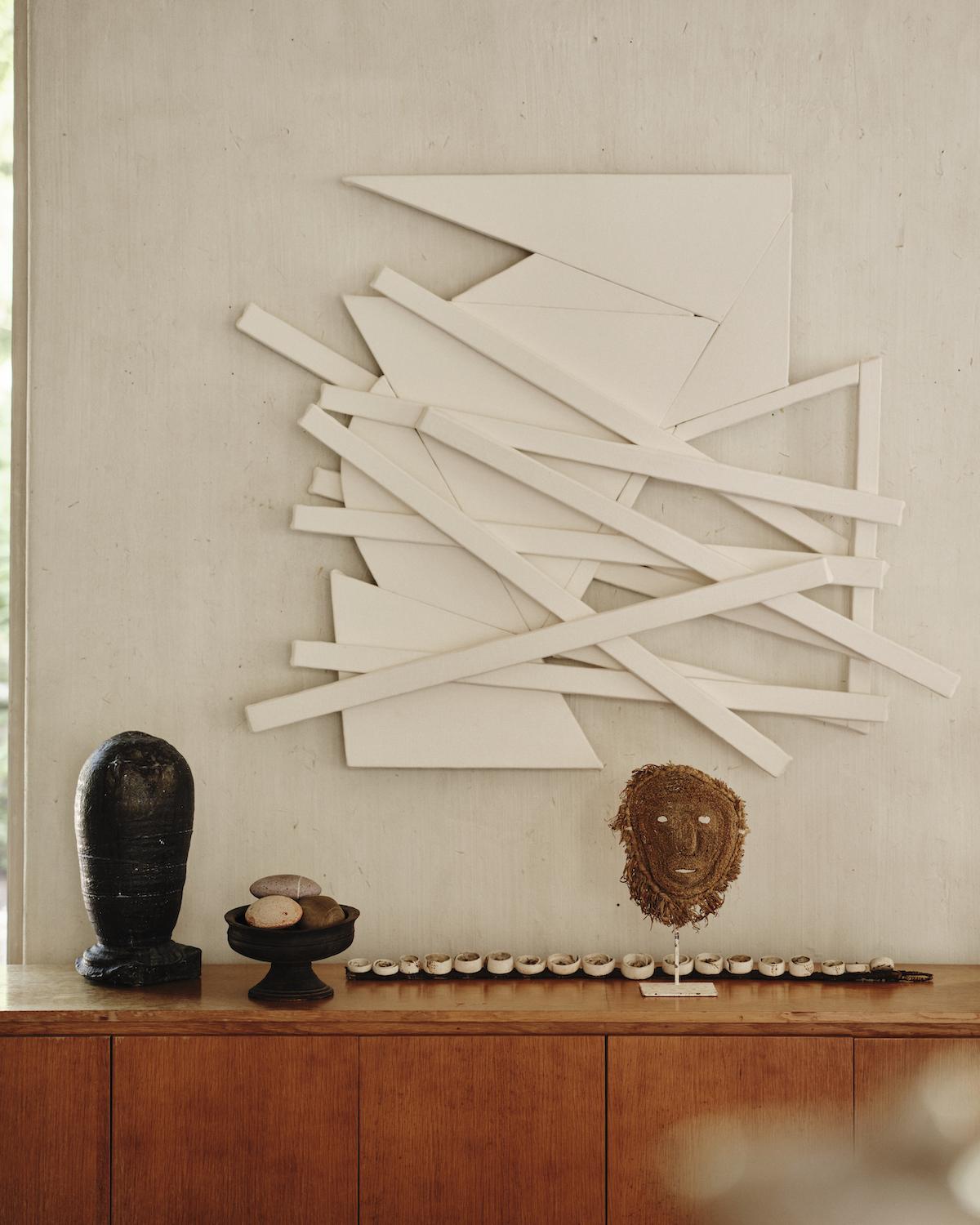 A Summer Arrangement: Object &amp; Thing at LongHouse. LongHouse, East Hampton, New York. Photo by Adrian Gaut. Works pictured: [wall] Wyatt Kahn, Untitled, (2021); [console, left to right] Adam Silverman, Untitled (2018–19); objects in the collection of LongHouse.