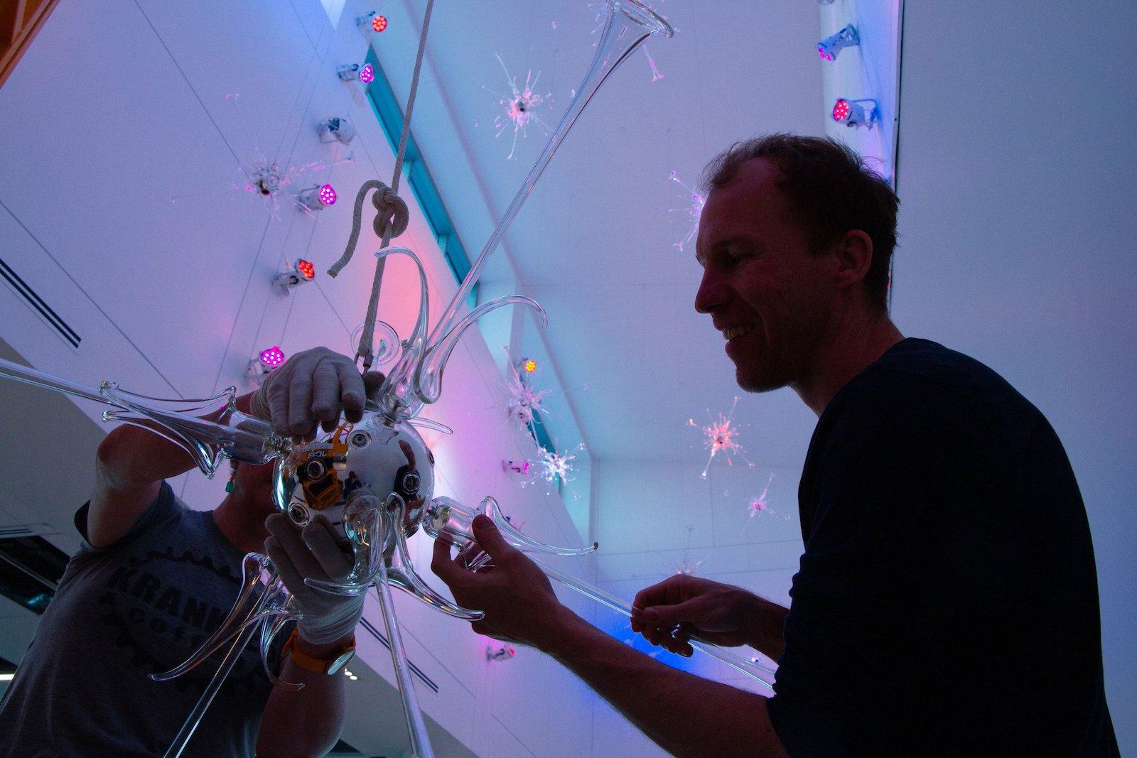 Davis installing Antinomies. Photo by Morgan Collini.
