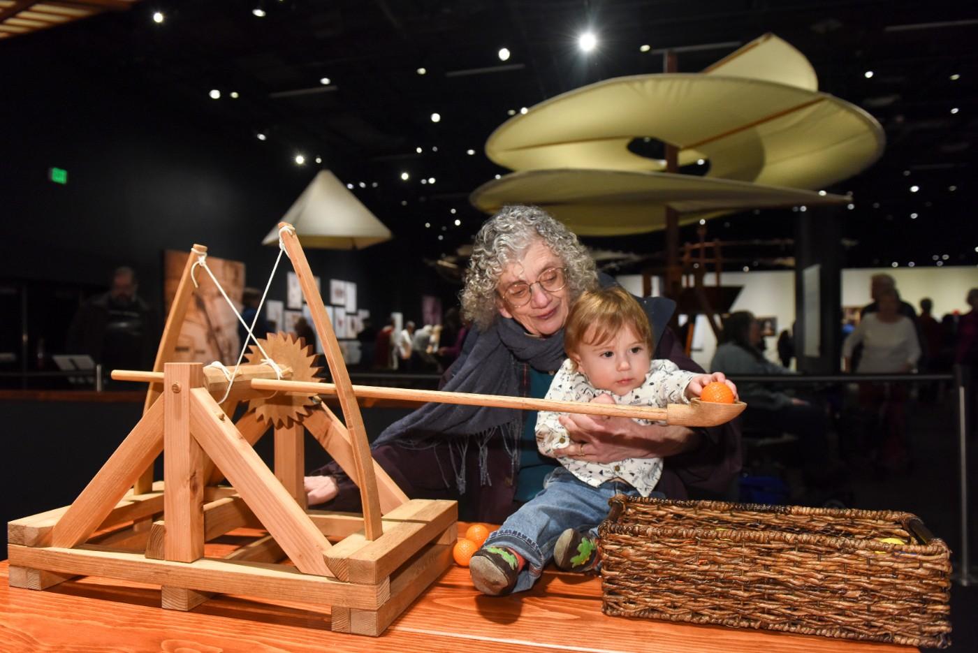 Visitors explore interactive models of da Vinci's inventions.