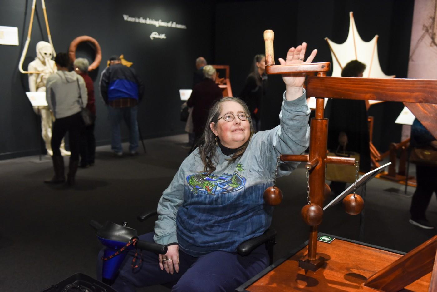 Visitors explore interactive models of da Vinci's inventions.