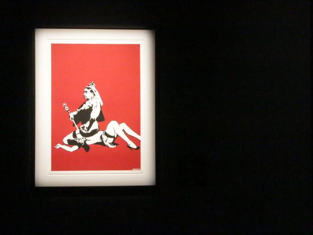 Installation view of Banksy- Genius or Vandal? featuring Queen Vic