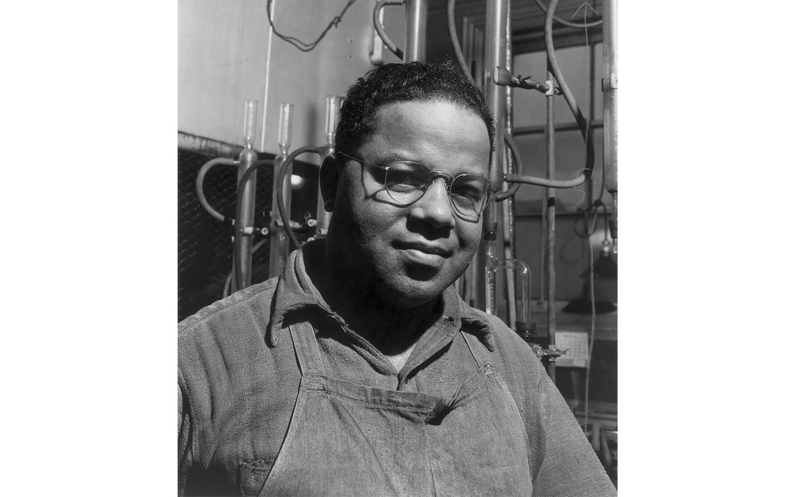 Gordon Parks, An assistant in one of the laboratories where varieties of greases are tested and analyzed, March 1944.