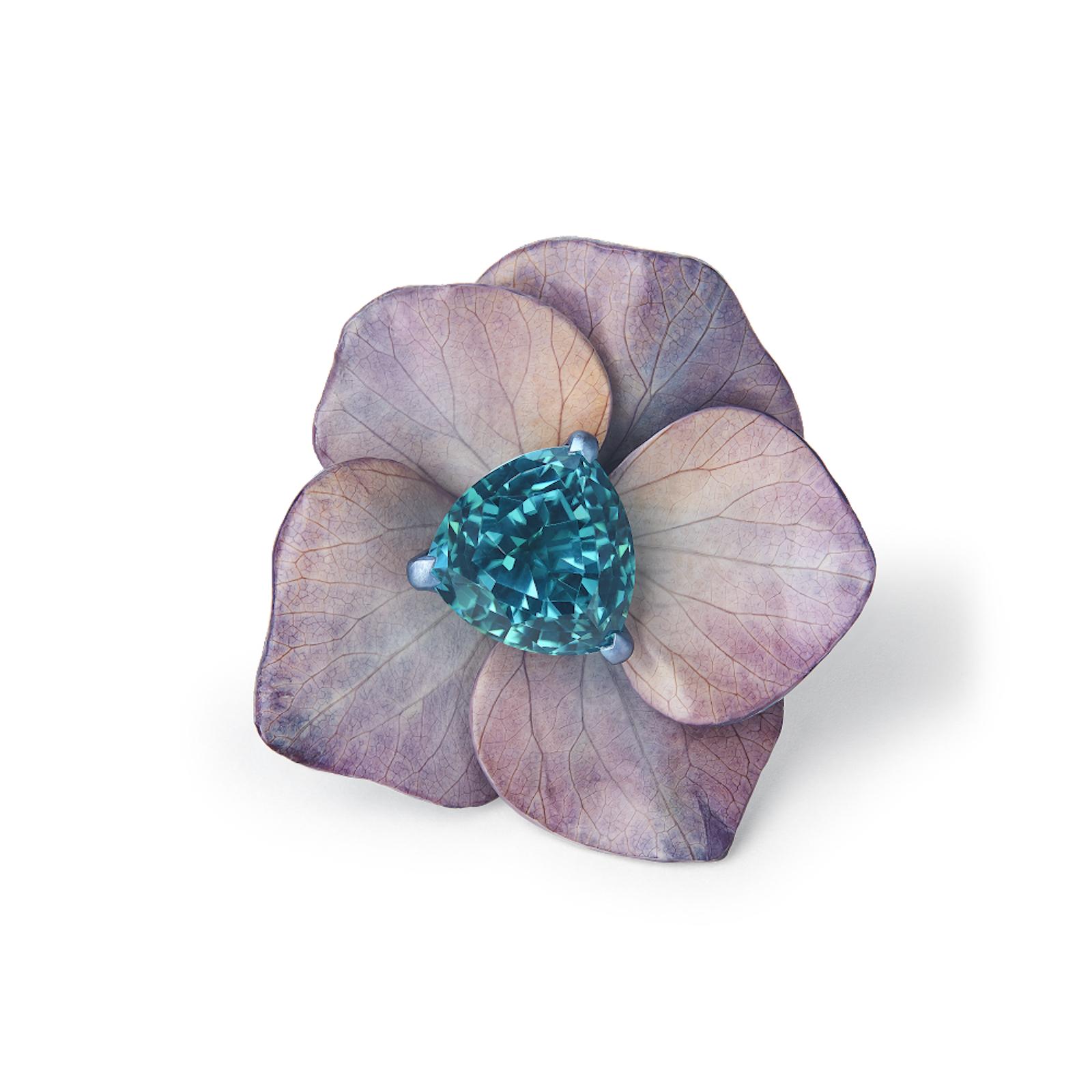 top view of the purple petal and large central blue gemmed ring