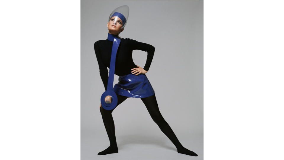Terry O'Neill (British, born 1938). Raquel Welch in a Pierre Cardin outfit featuring a miniskirt and necklace in blue vinyl, worn with a Plexiglas visor, 1970.