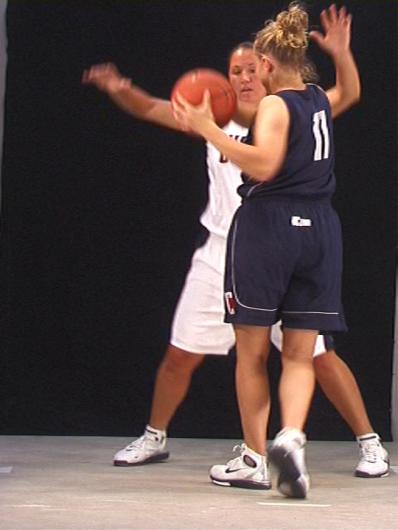 two women in uniform, practicing a drill. 